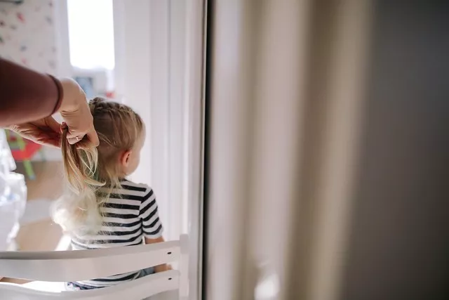 adult-braiding-child-1684035